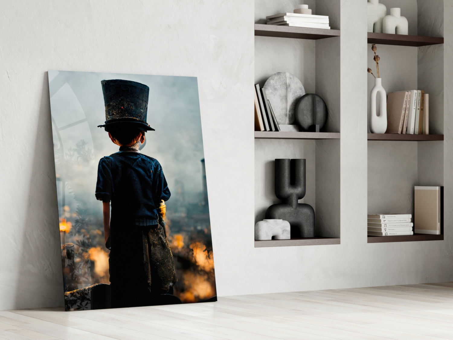 Glass art leaning against white wall showing child in top hat overlooking burning cityscape, displayed in minimalist interior setting with shelving.