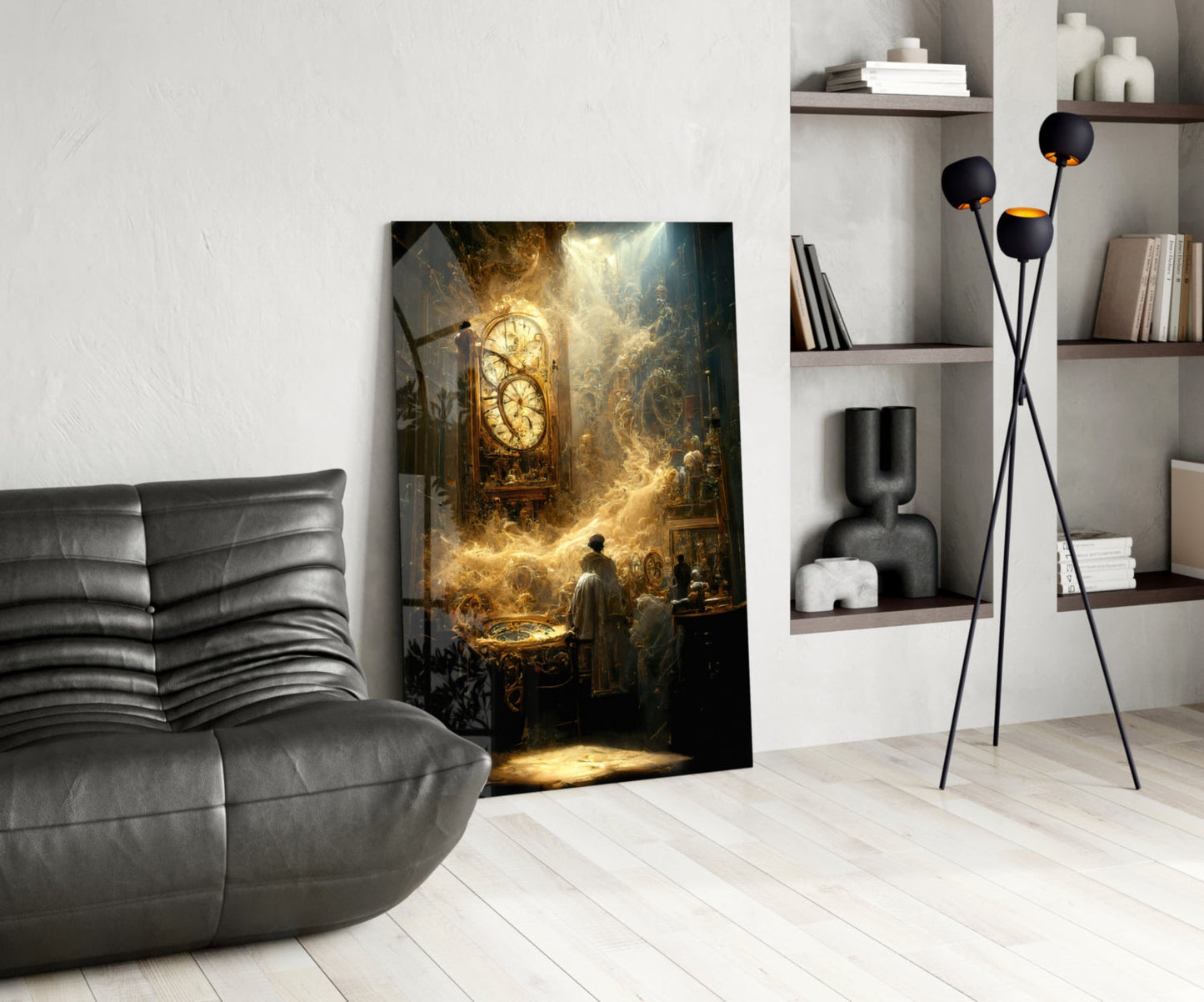 Modern interior room with gray leather sofa, framed golden-toned artwork of a clock and figures, black floor lamp, and white shelving unit.