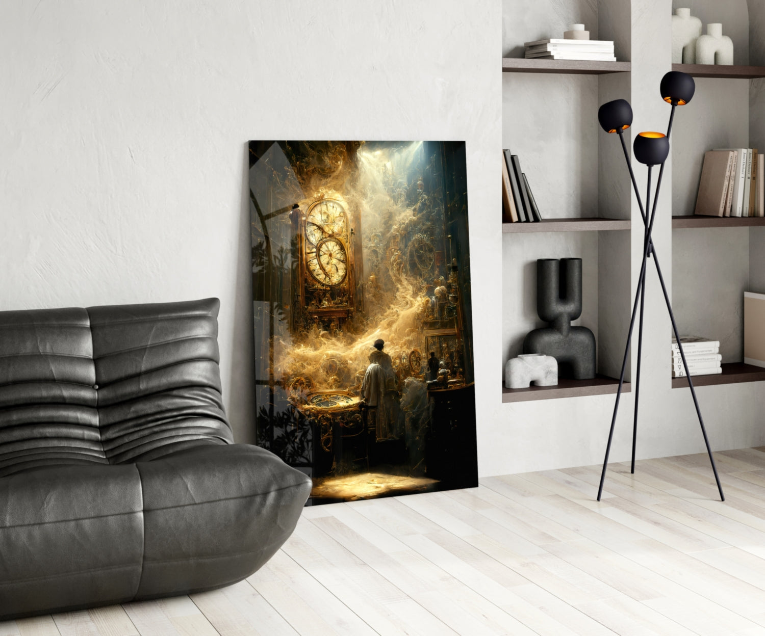 Modern interior room with gray leather sofa, framed golden-toned artwork of a clock and figures, black floor lamp, and white shelving unit.