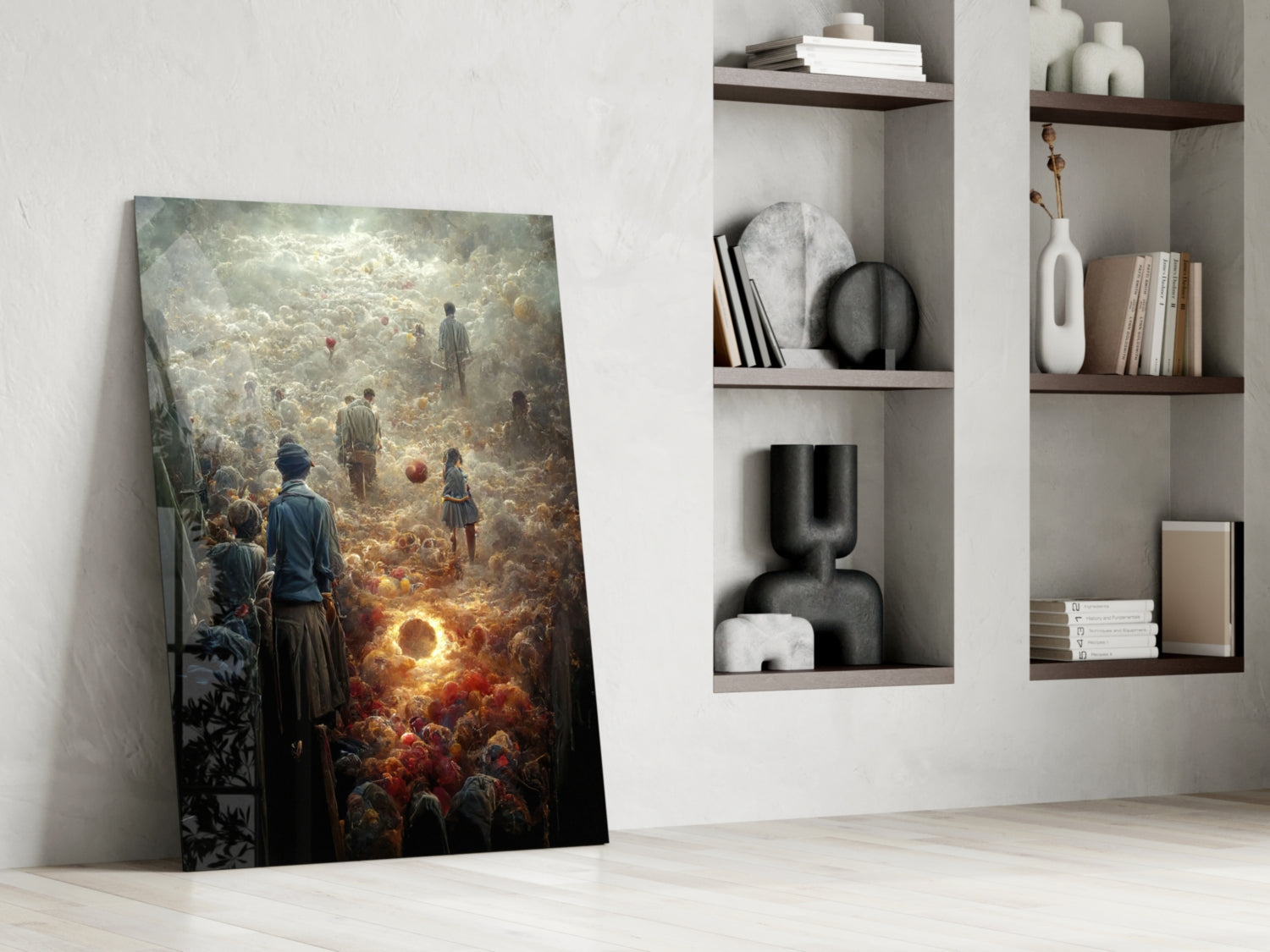 Leaning against white wall, vertical glass art panel depicting a glowing golden orb surrounded by a crowd of figures in warm and cool tones, displayed in minimalist room setting with wooden shelves and white vessels.