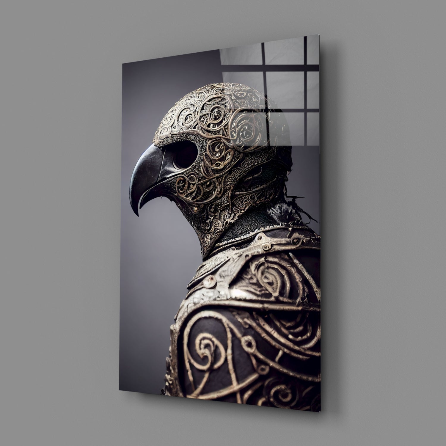 Ornate metal bird skull with intricate filigree detailing displayed on angled glass panel against gray wall.