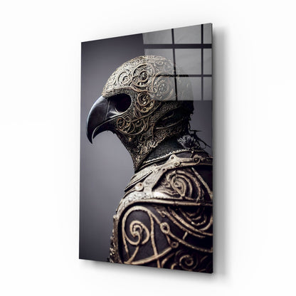 Ornate metallic bird helmet sculpture in profile against gray background, displayed on black-gridded glass panel.