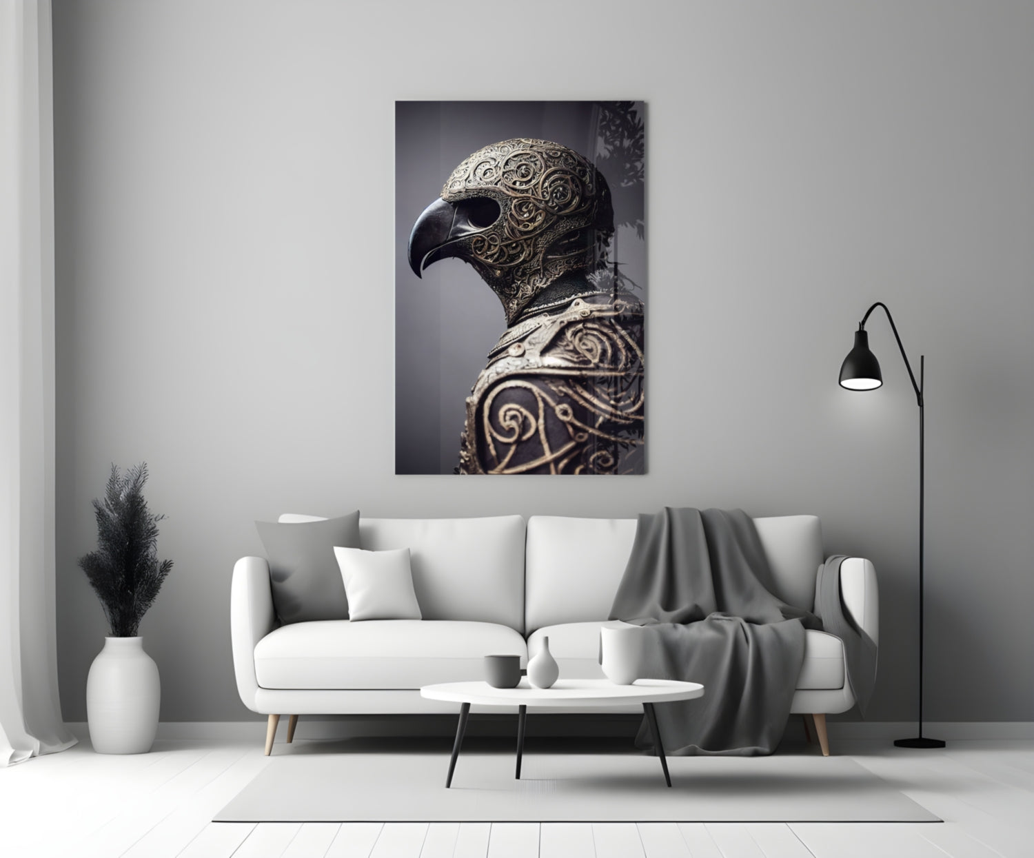 Ornate metallic eagle head sculpture with intricate scrollwork displayed on white wall above gray sofa in modern interior.