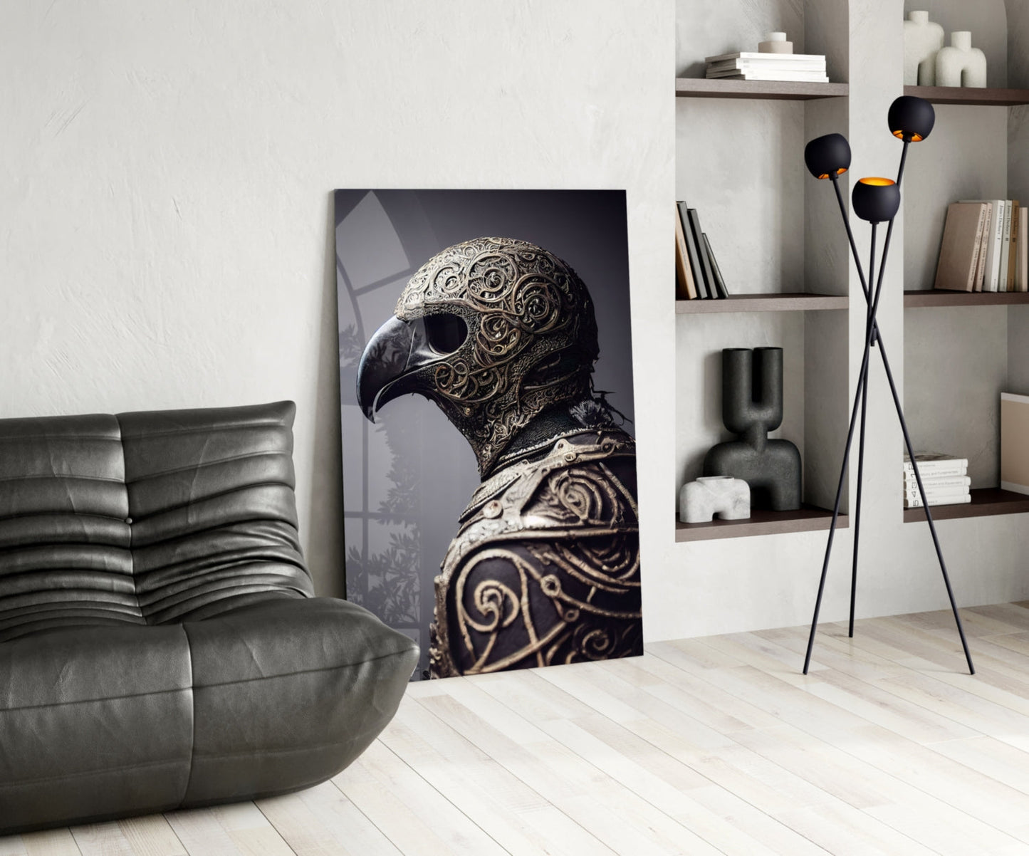 Ornate black and gold bird helmet artwork displayed vertically in modern living room with leather chair and shelving.