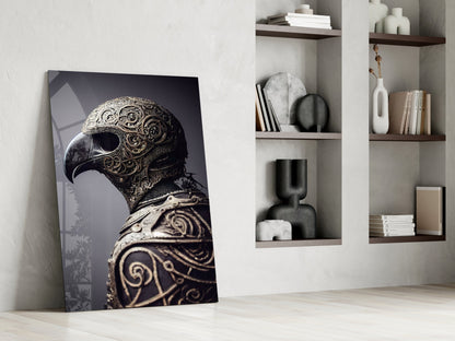 Ornate gold-detailed bird helmet canvas leaning against white wall beside shelving with books and decorative objects.