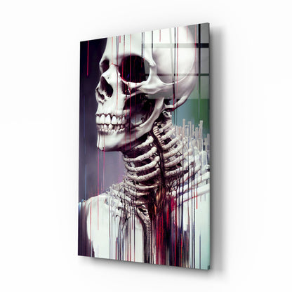 Anatomical skeleton and skull with ribcage displayed on glass art panel with vertical streaks of red, white, and green gradient coloring, angled three-quarter view.