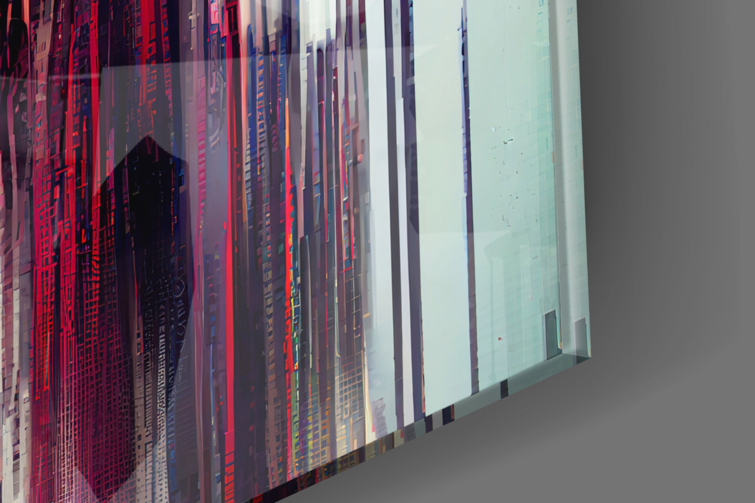 Close-up angled view of layered glass art with red, blue, and white color gradients and printed architectural imagery, right edge showing pale green panel.