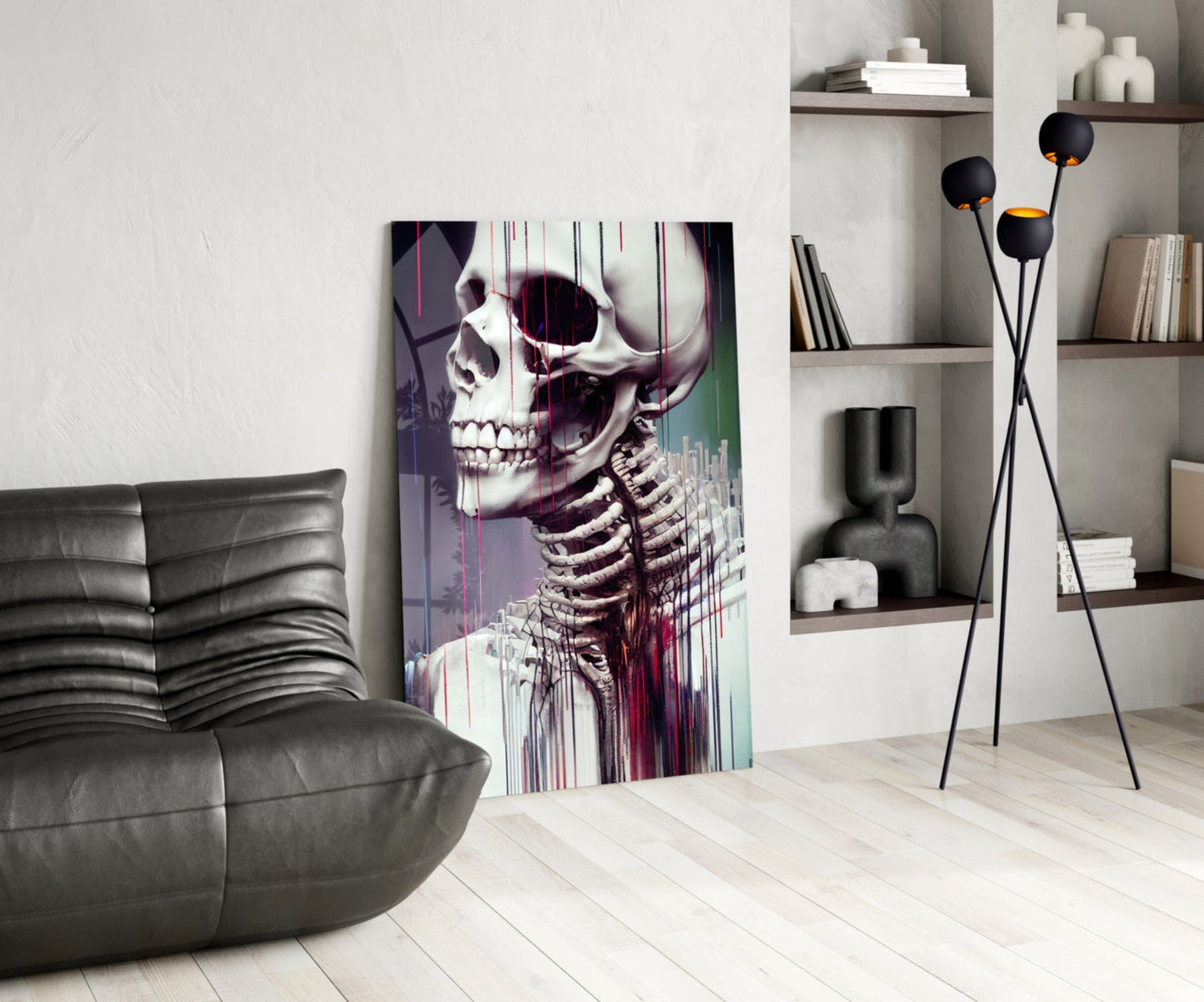 Modern living room featuring anatomical skeleton glass art with purple and teal glitch effect displayed leaning against wall beside grey leather sofa.