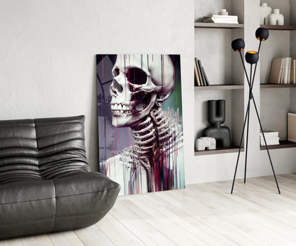 Modern living room featuring anatomical skeleton glass art with purple and teal glitch effect displayed leaning against wall beside grey leather sofa.