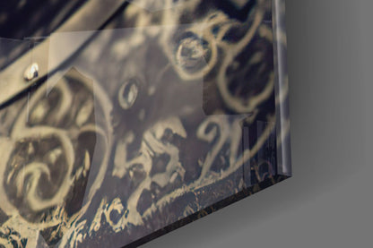 Close-up angled view of engraved decorative birds and floral motifs on frosted glass panel.