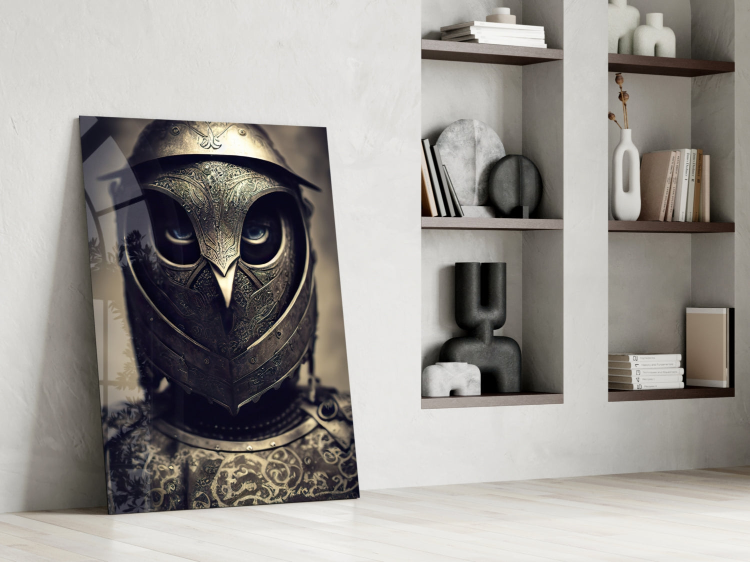 Ornate golden owl helmet artwork leaning against white wall beside minimalist shelving with books and decorative objects.