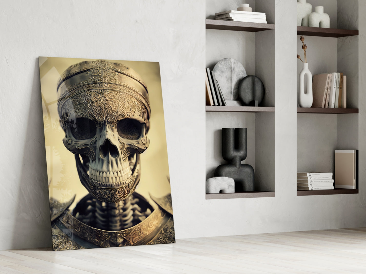 Ornate golden skull artwork leaning against white wall beside shelving unit with decorative objects and books.