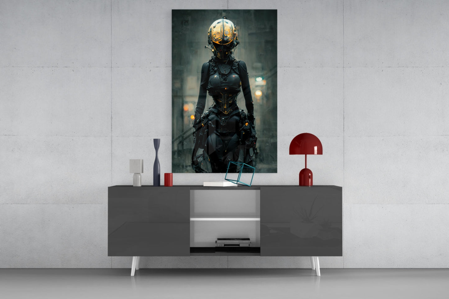 Futuristic female cyborg artwork displayed above gray sideboard with white legs, red lamp, and decorative accessories against white wall.