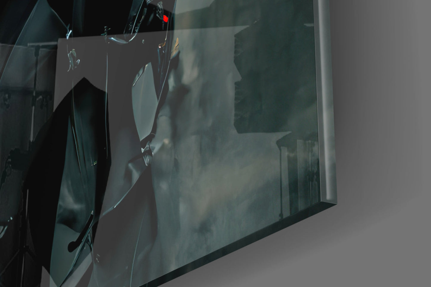 Close-up angled view of frosted glass art panel showing silhouette profile design with dark teal coloring and metallic hardware.