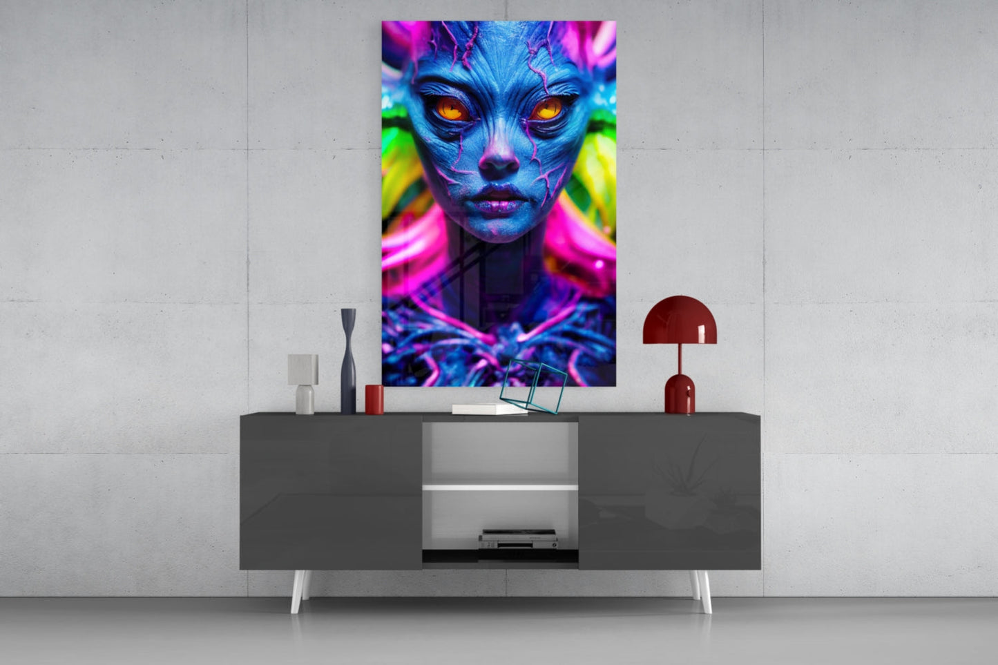 Vibrant neon portrait with blue skin and glowing orange eyes displayed on glass wall art above gray console table.