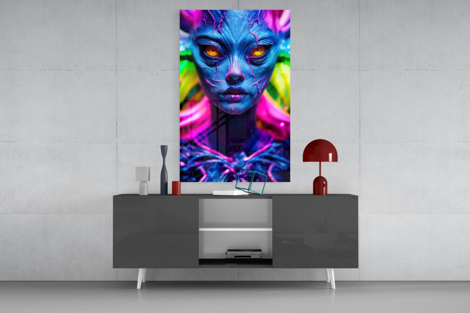 Vibrant neon portrait with blue skin and glowing orange eyes displayed on glass wall art above gray console table.