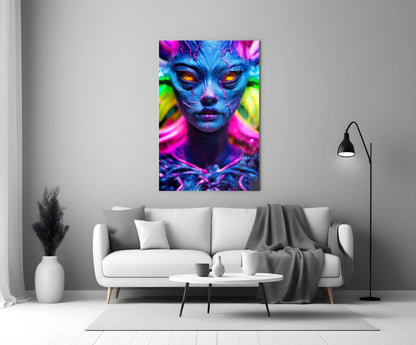 Neon blue alien face with glowing orange eyes and vibrant magenta and green lighting displayed as glass wall art above a white sofa.