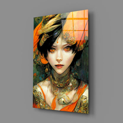 Glass wall art depicting an illustrated woman with golden eyes, ornate jewelry, and orange and green patterned clothing against a gray background.