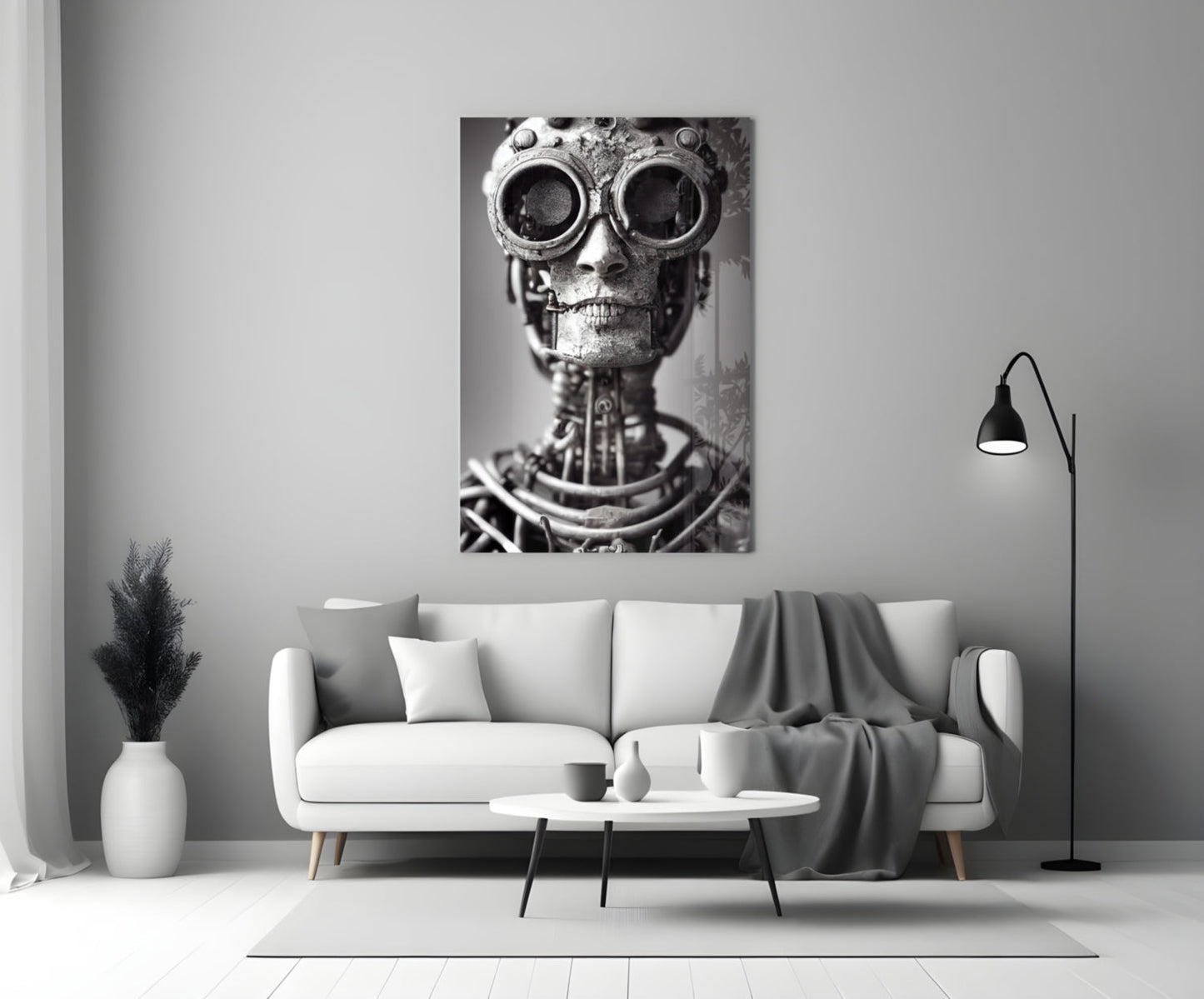 Steampunk skull with large circular goggles and mechanical details displayed as black and white canvas art above a modern living room sofa.