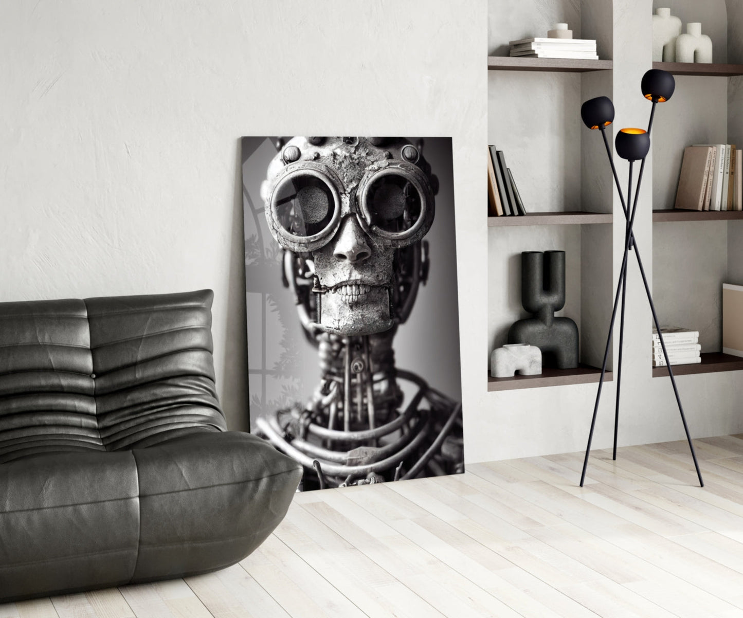 Black and white steampunk skull artwork displayed in modern living room with gray sofa and shelving.
