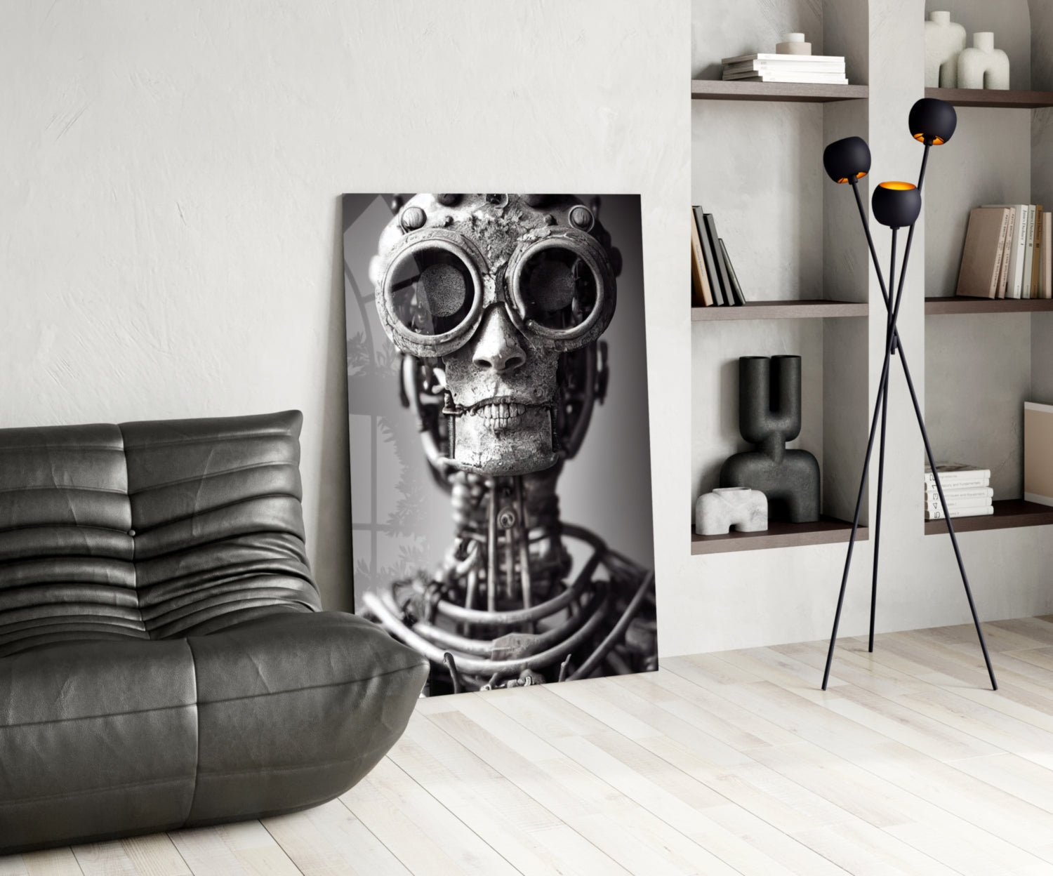 Black and white steampunk skull artwork displayed in modern living room with gray sofa and shelving.