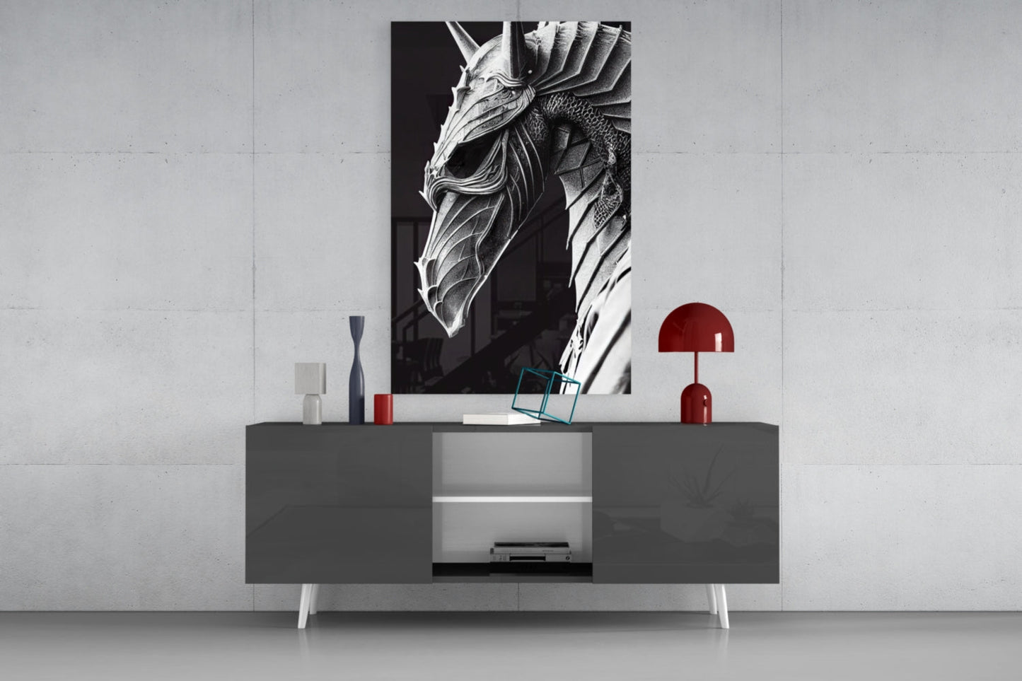Black and white dragon head glass art displayed on gray media console with red lamp and decorative objects against white wall.