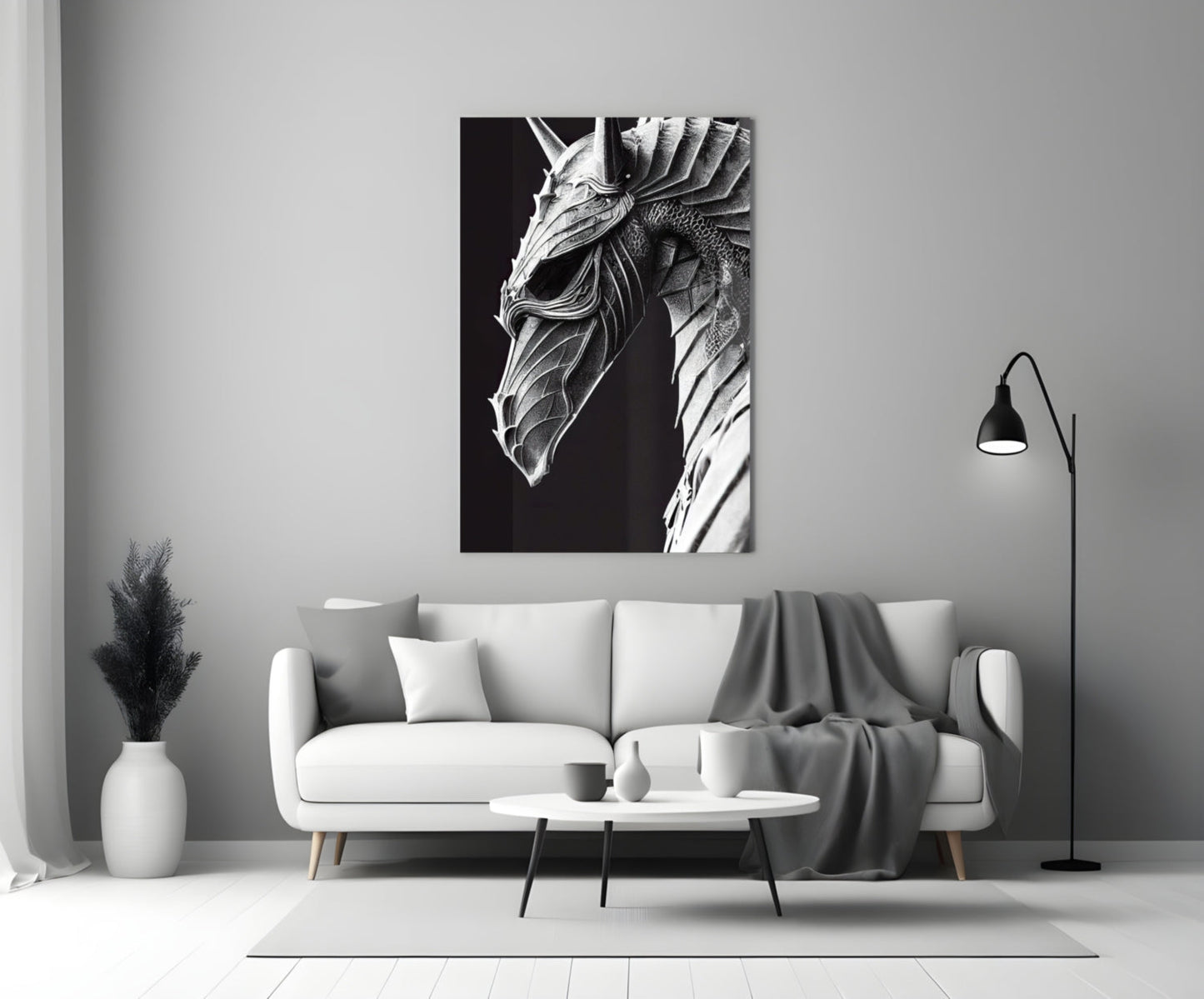 Black and white detailed dragon head artwork displayed above a white sofa in a minimalist living room setting.