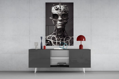 Monochromatic robotic head artwork displayed above gray media console with red decorative lamp and accessories.