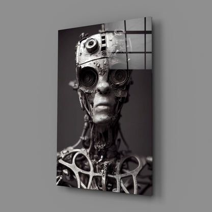 Black and white glass art panel showing mechanical humanoid head with speaker-lens eyes and grid overlay, mounted on gray wall.