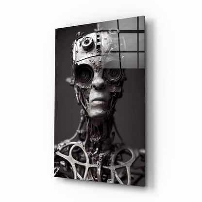 Monochromatic glass art panel displaying sculptural human head with mechanical camera lenses for eyes against dark background.