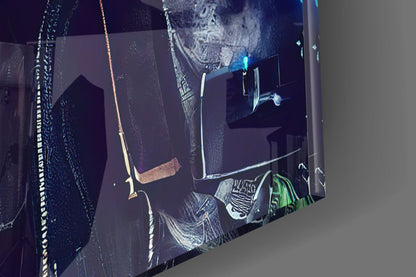 Close-up angled view of glass wall art displaying detailed etched survival tools in white against dark background with green accents.
