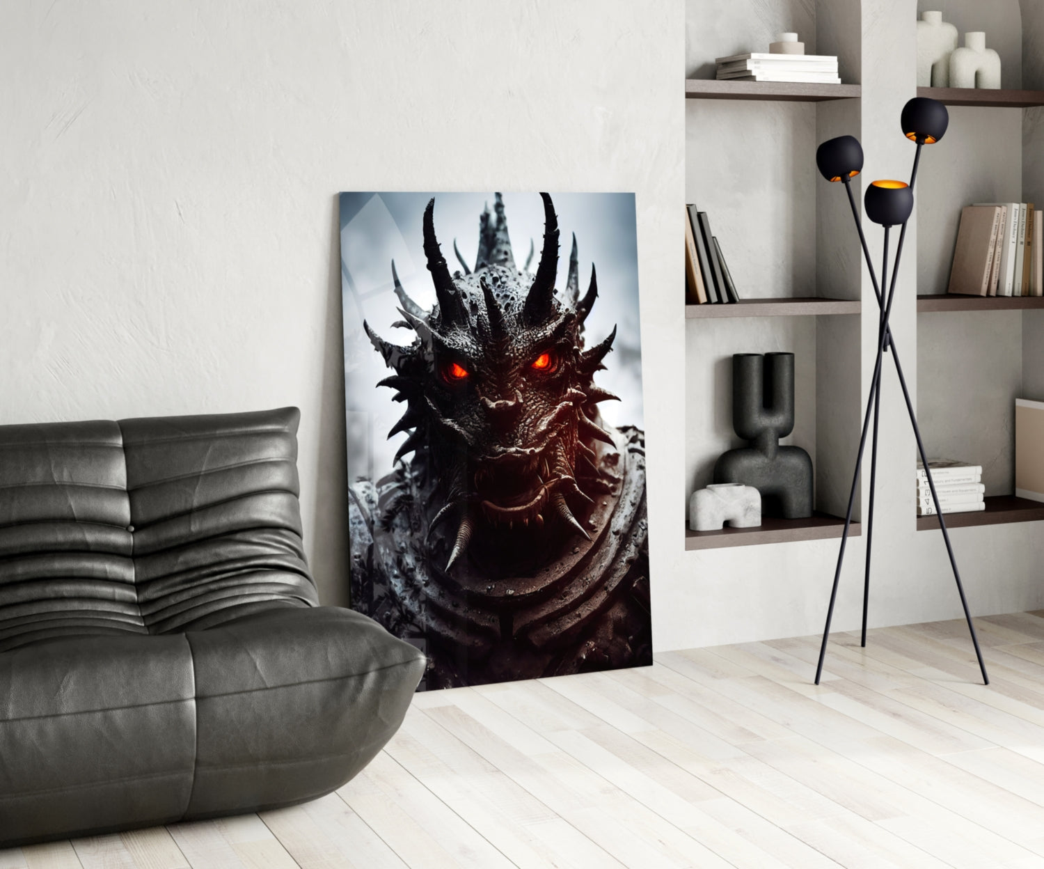 A dark dragon head glass wall art with glowing orange eyes displayed in a modern living room beside a gray sofa.