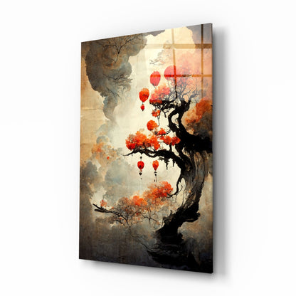 Glass art panel angled perspective showing gnarled tree with orange foliage and red lanterns against cream and gray misty background.