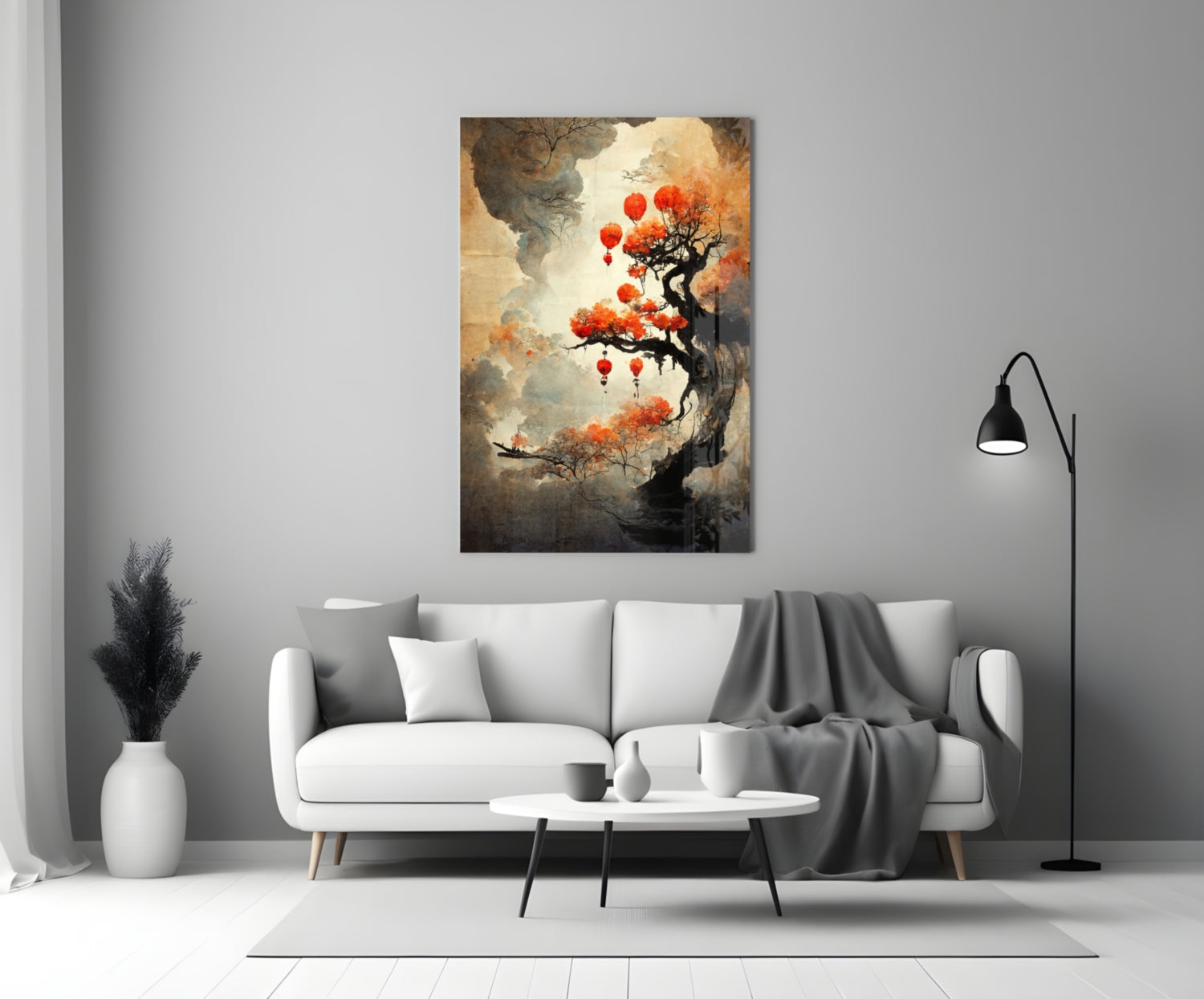 Tree of Hope Glass Art featuring a gnarled black tree with red lanterns and orange foliage displayed above a white sofa in a modern living room.