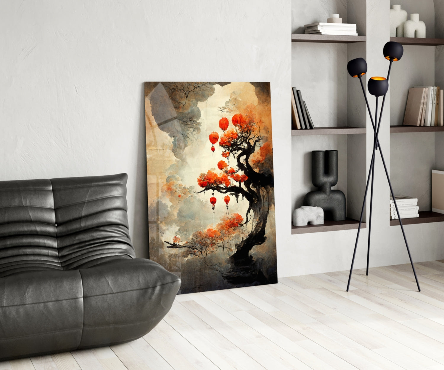 Tree of Hope Glass Art leaning against white wall in modern living room with black leather chair and shelving unit.