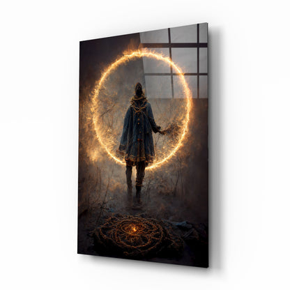 Angled view of glass wall art displaying a hooded figure standing before a glowing golden circular portal in a dark, atmospheric setting.