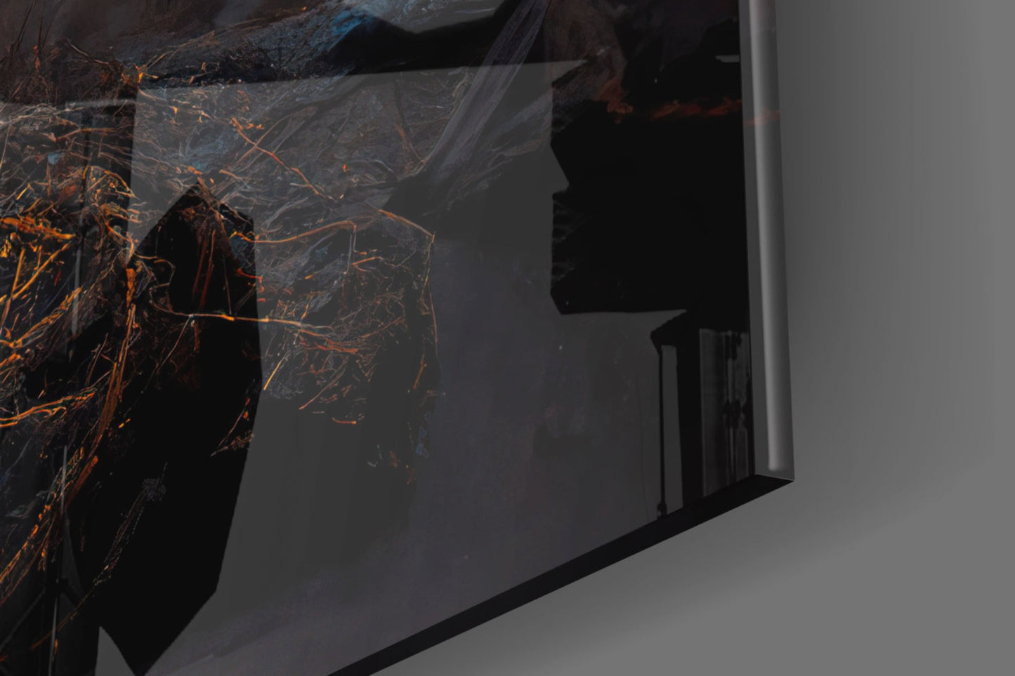 Circle Glass Wall Art with abstract orange and black branching design displayed on white wall, angled view showing glass thickness and shadow.