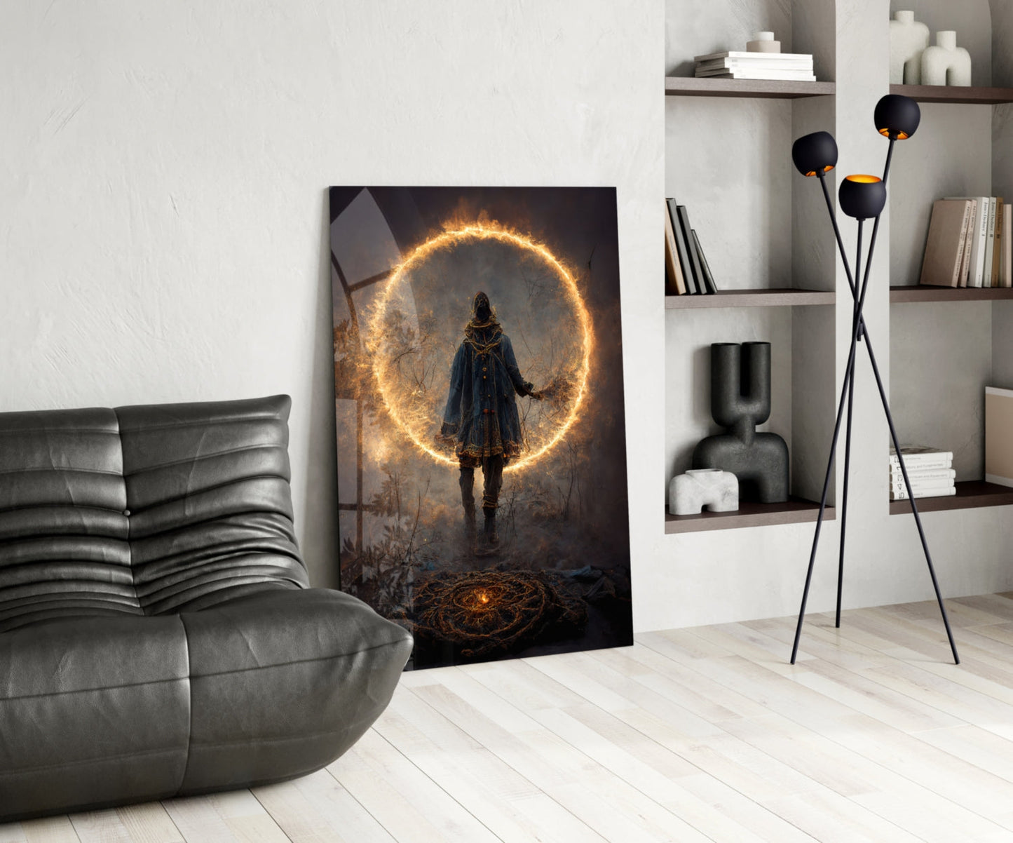 Glowing circular wall art showing a hooded figure facing an illuminated golden ring portal, leaning against a gray leather chair in a modern living room setting.