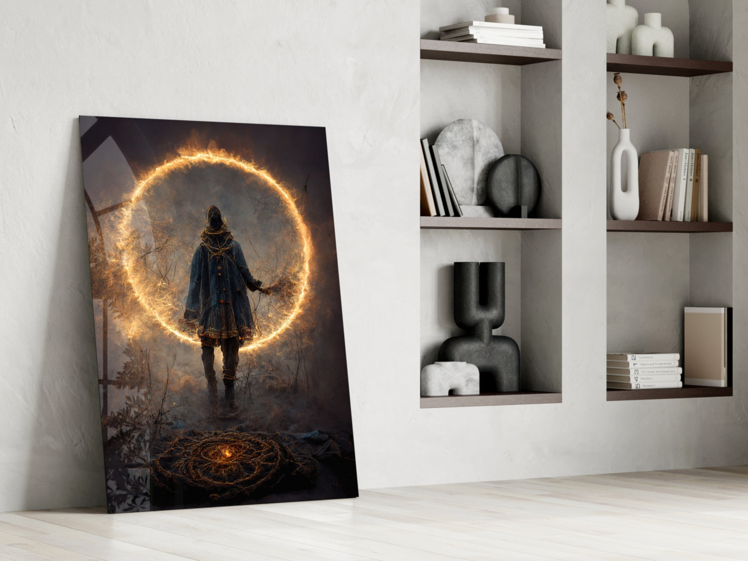 Framed glass wall art leaning against white wall displays a figure in blue coat beneath a glowing golden circle in dark forest setting.