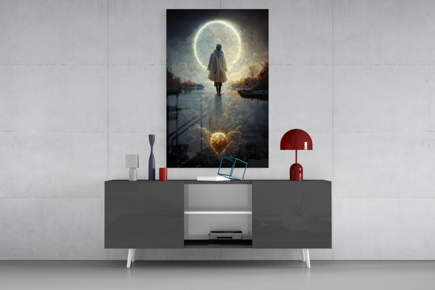 Glass wall art featuring a figure standing before a glowing moon reflected in water, displayed above a gray media console with red lamp.