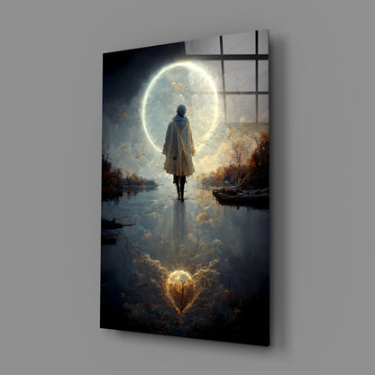 Angled view of glass wall art showing a cloaked figure standing in water beneath a glowing moon, with autumn foliage and window frame overlay.