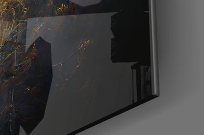 Close-up angled view of black glass wall art with golden branching lines and sparkles against gray wall backdrop.