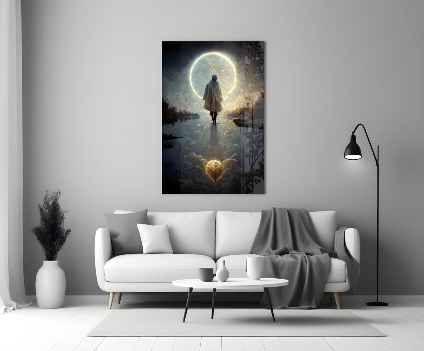 Modern living room with white sofa displaying glowing moon and figure glass wall art above coffee table.