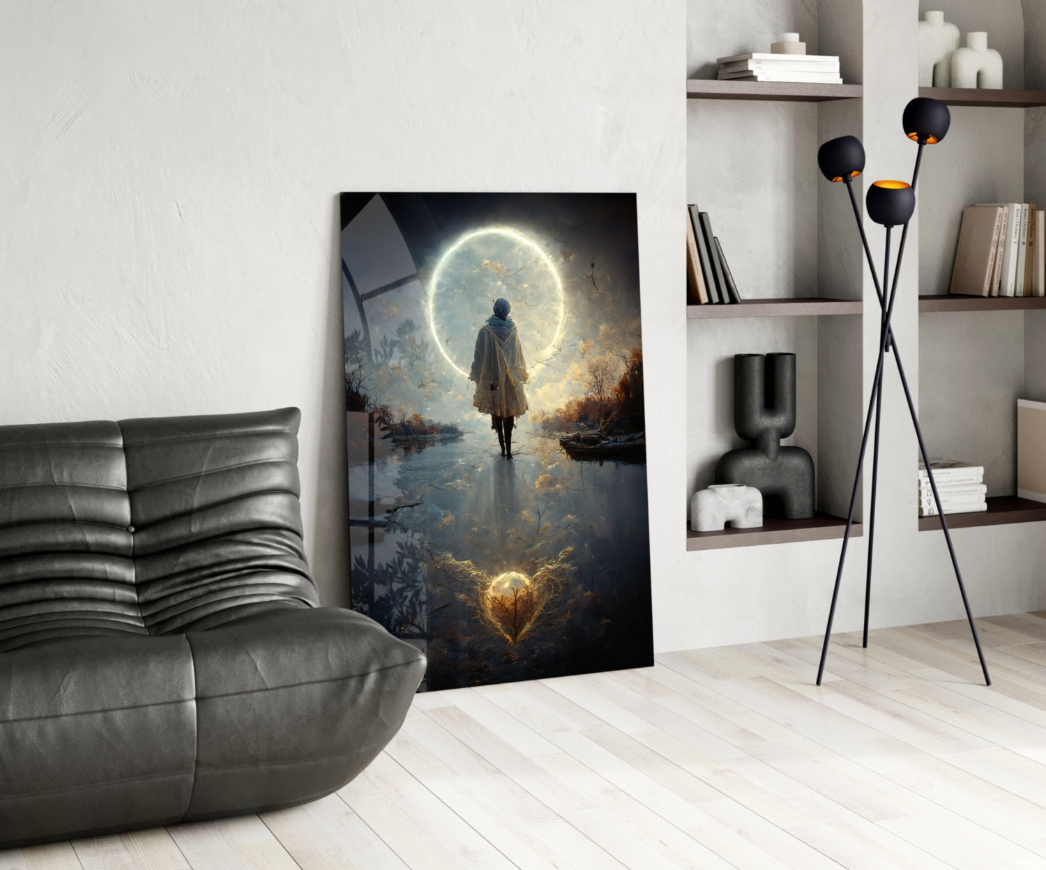 Modern living room displaying a vertical glass wall art panel featuring a robed figure standing before a luminous moon reflected in water.