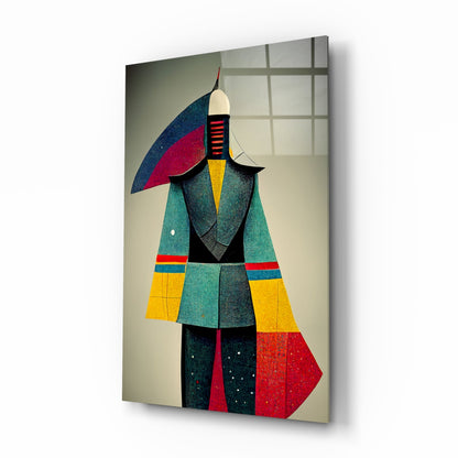 Geometric art glass panel displaying stylized figure in colorful blocks of teal, yellow, red, and black with pointed hat, shown at three-quarter angle against neutral background.