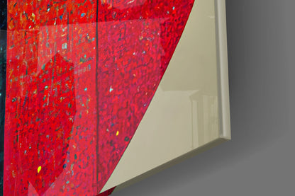 Close-up angled view of vibrant red glass art panel with multicolored speckled texture against neutral wall background.