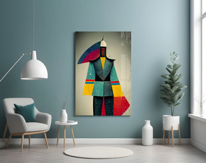 Colorful geometric glass art depicting an abstract figure in blue, red, yellow, and teal, displayed on a light blue wall above a white chair.