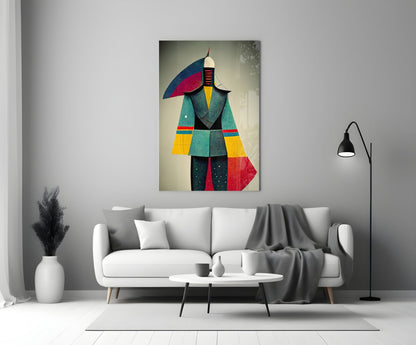 Colorful abstract glass art depicting a geometric figure in teal, red, yellow, and blue displayed above a white sofa in a modern living room.