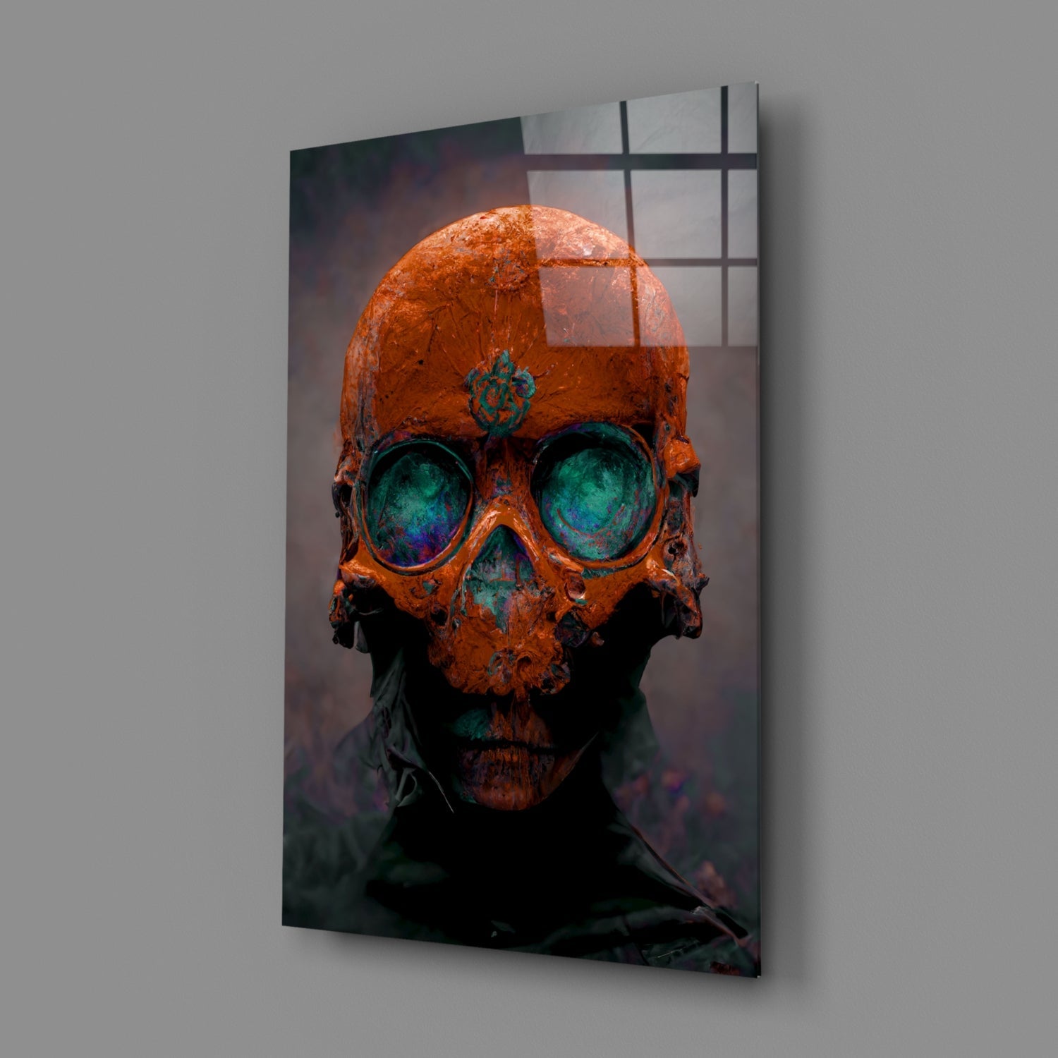 Angled view of glass art panel displaying rust-orange skull with turquoise eye sockets against dark background.