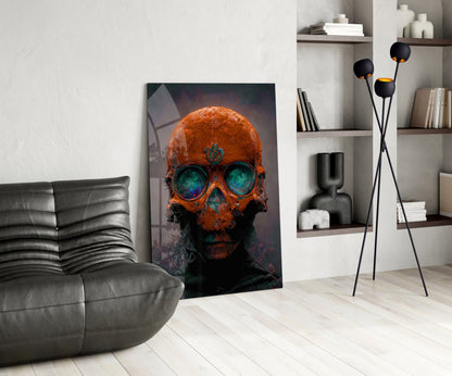 Orange and teal skull glass art leaning against white wall in modern living room with gray sofa and shelving.